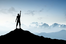 Man standing on top of a mountain