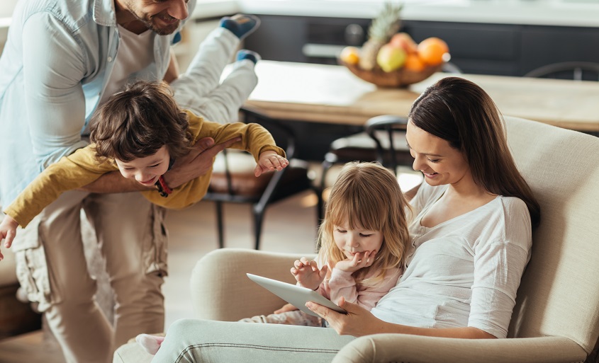 Close up of a happy young family having good time together.