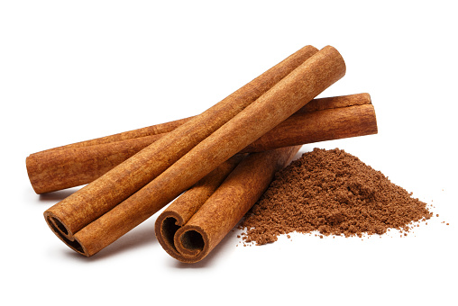 Cinnamon sticks and powder, isolated on white background