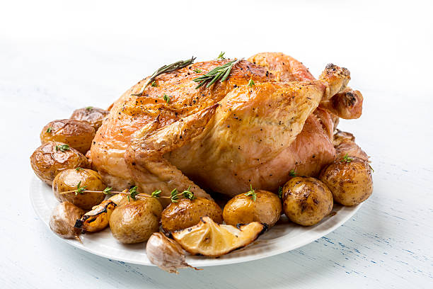 Whole Roasted Chicken with New Potatoes, Mushrooms, Lemon Edges and Garlic Cloves