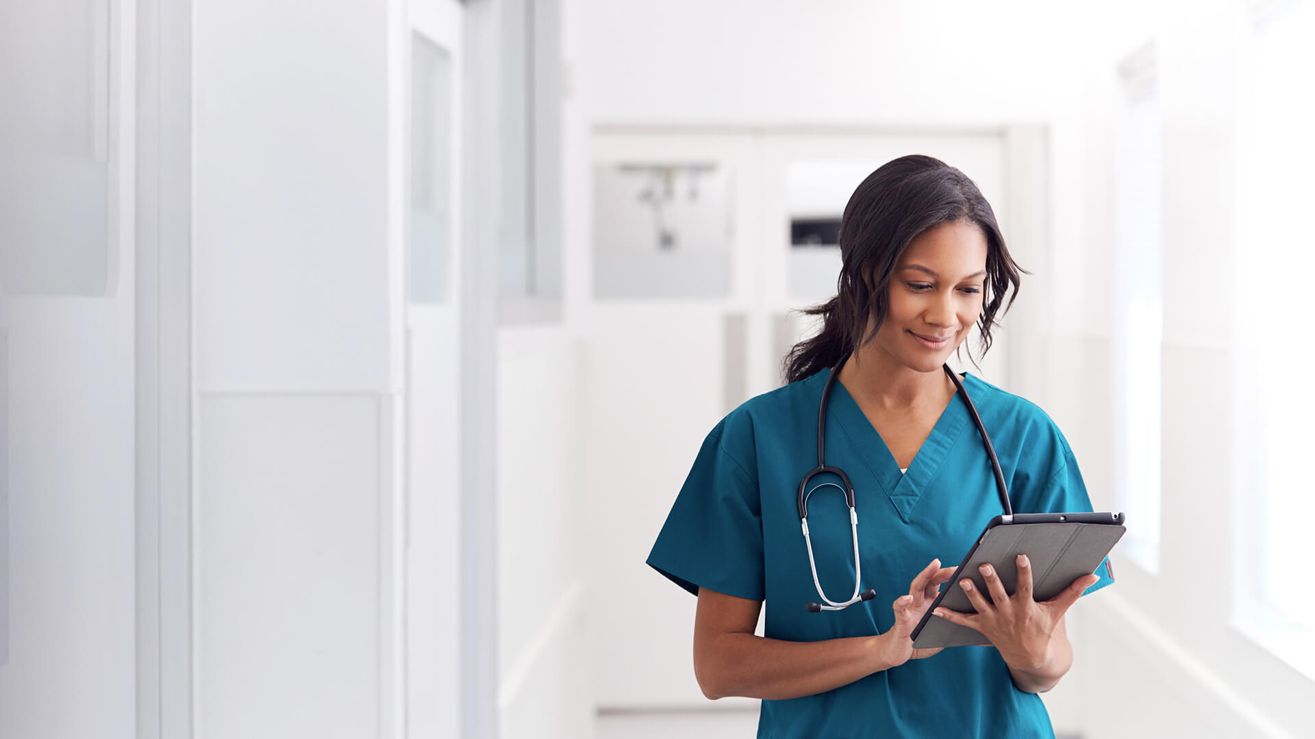 Vet on a tablet having a conversation with a client over video chat